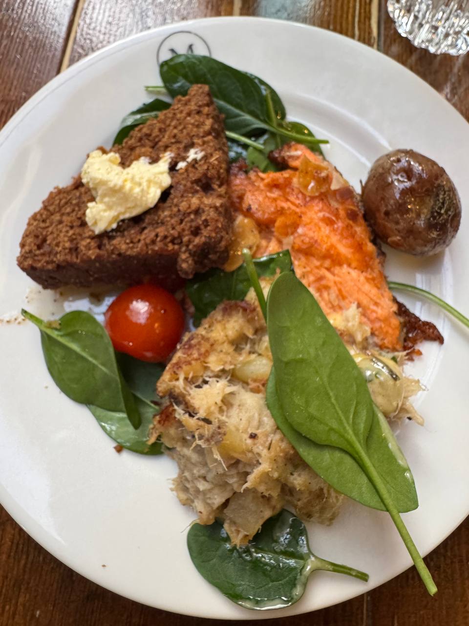 Icelandic Arctic char with traditional rye bread and sides served during a Reykjavik Food Tours experience with our agency