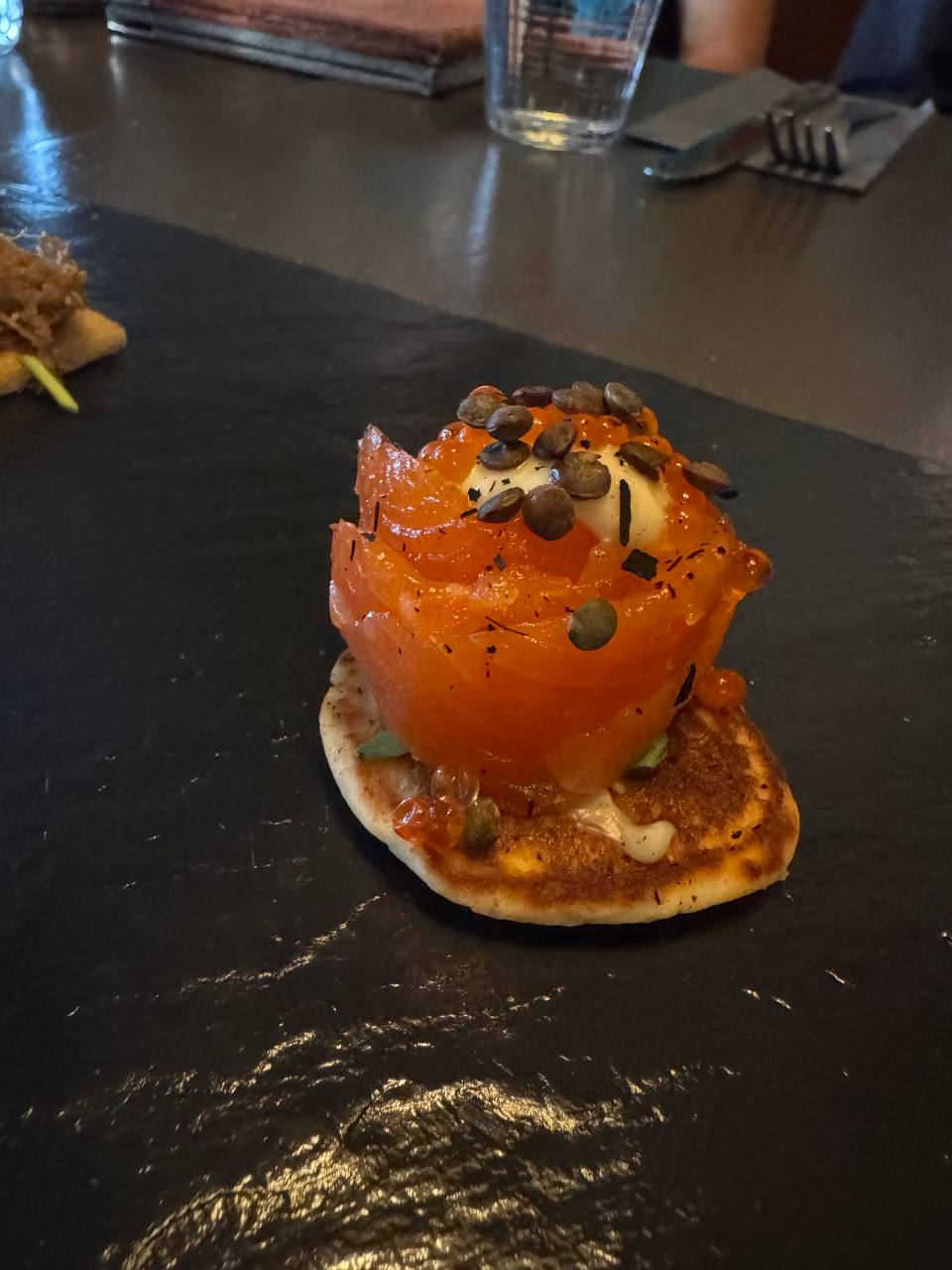 Traditional Icelandic smoked Arctic char appetizer with toppings and roe enjoyed on a Reykjavik Food Tours tasting tour with our agency