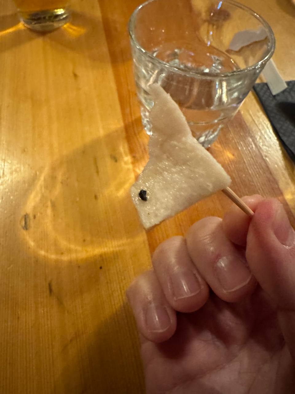 Traditional Icelandic fermented shark hákarl served as a tasting experience on a Reykjavik Food Tours tour with our agency