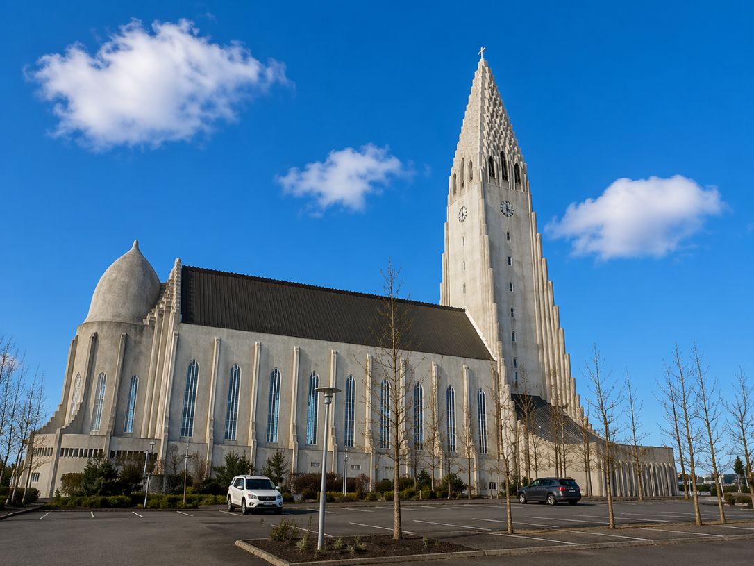 Hallgrímskirkja church in Reykjavik with its iconic tower under blue sky visited during a Reykjavik Food Tours experience with our agency